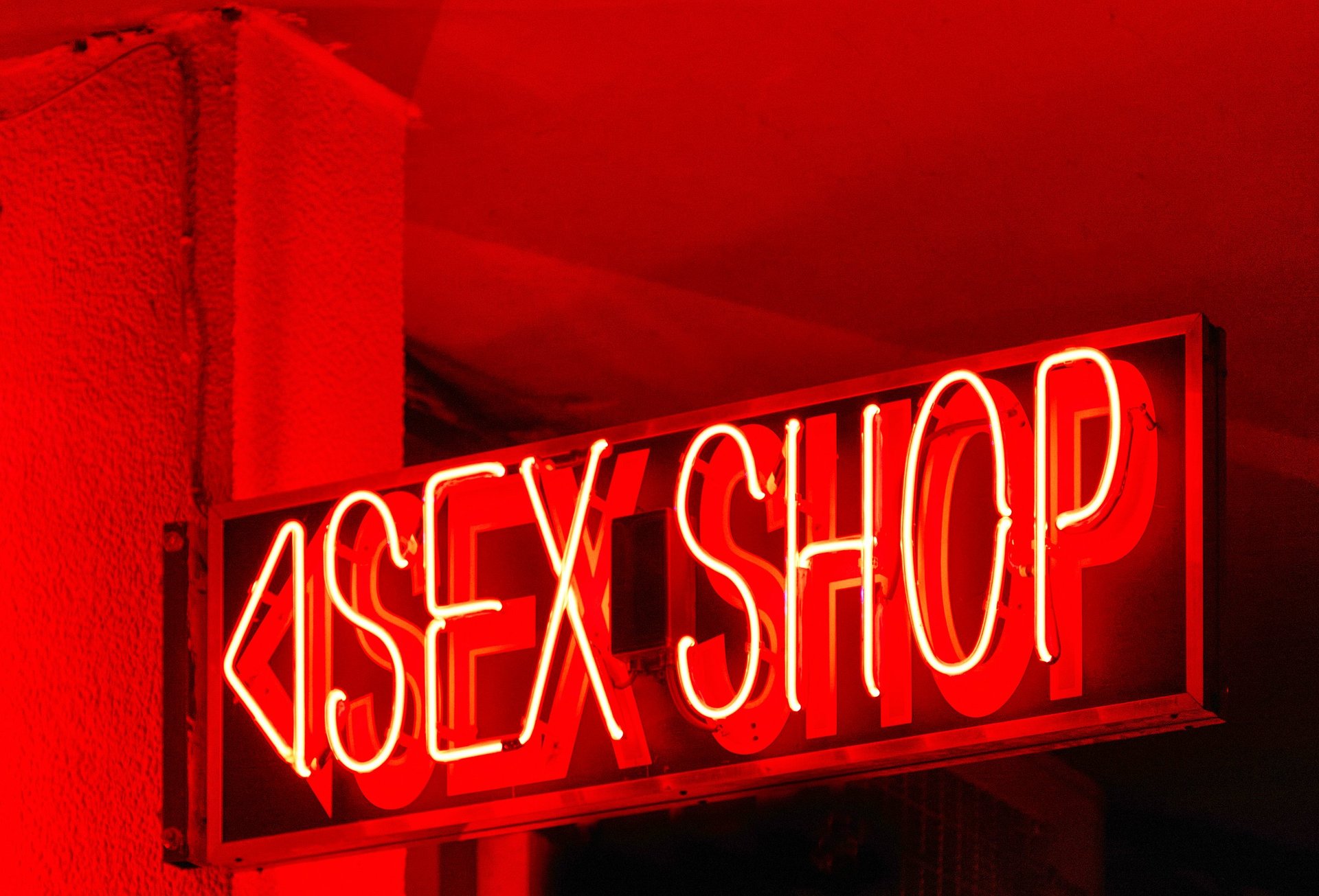 Bright red neon sign of sex shop